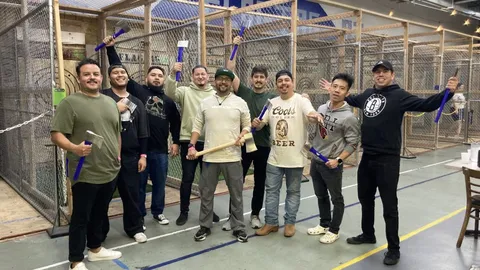 Group of co-workers axe throwing at FlagTagAZ in Flagstaff Arizona