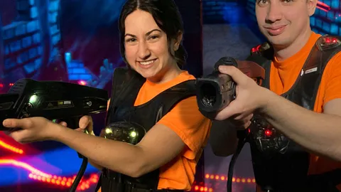 Two laser tag players inside the laser tag arena at FlagTagAZ