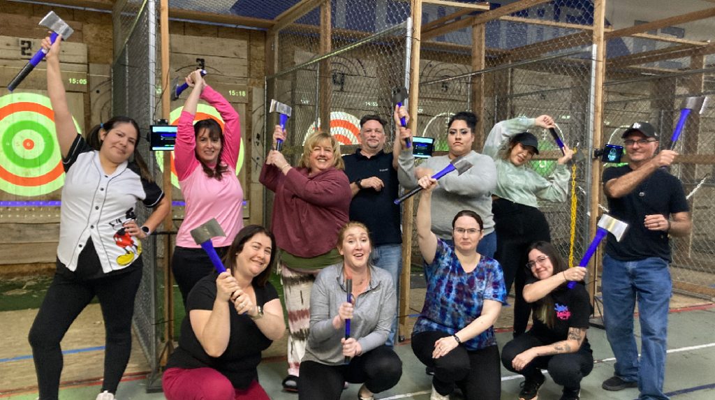 Group of People doing axe throwing